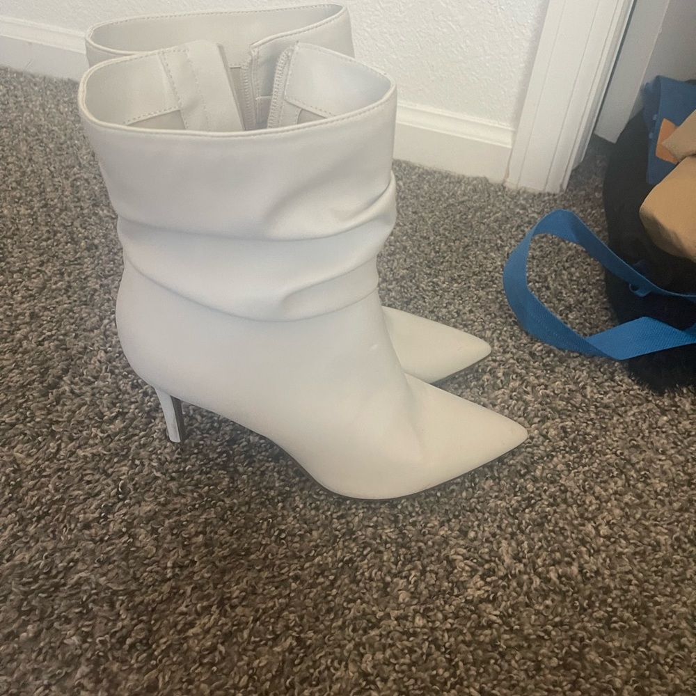 Woman’s white boots. Only wore a couple of times